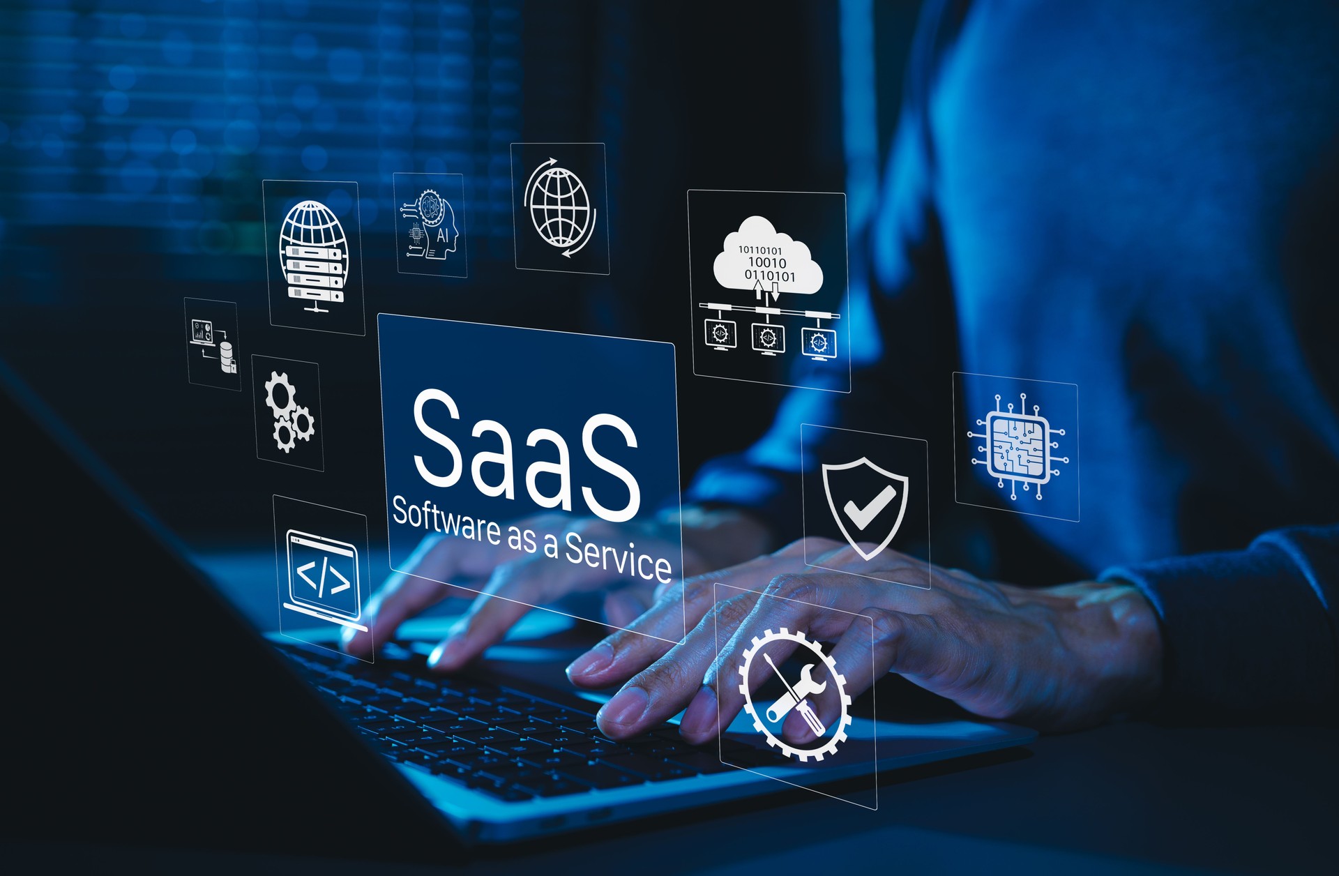 SaaS Software as a Service Digital Cloud Technology. Hands typing on laptop with SaaS icons representing cloud computing, data storage, software integration, security, and service based applications.